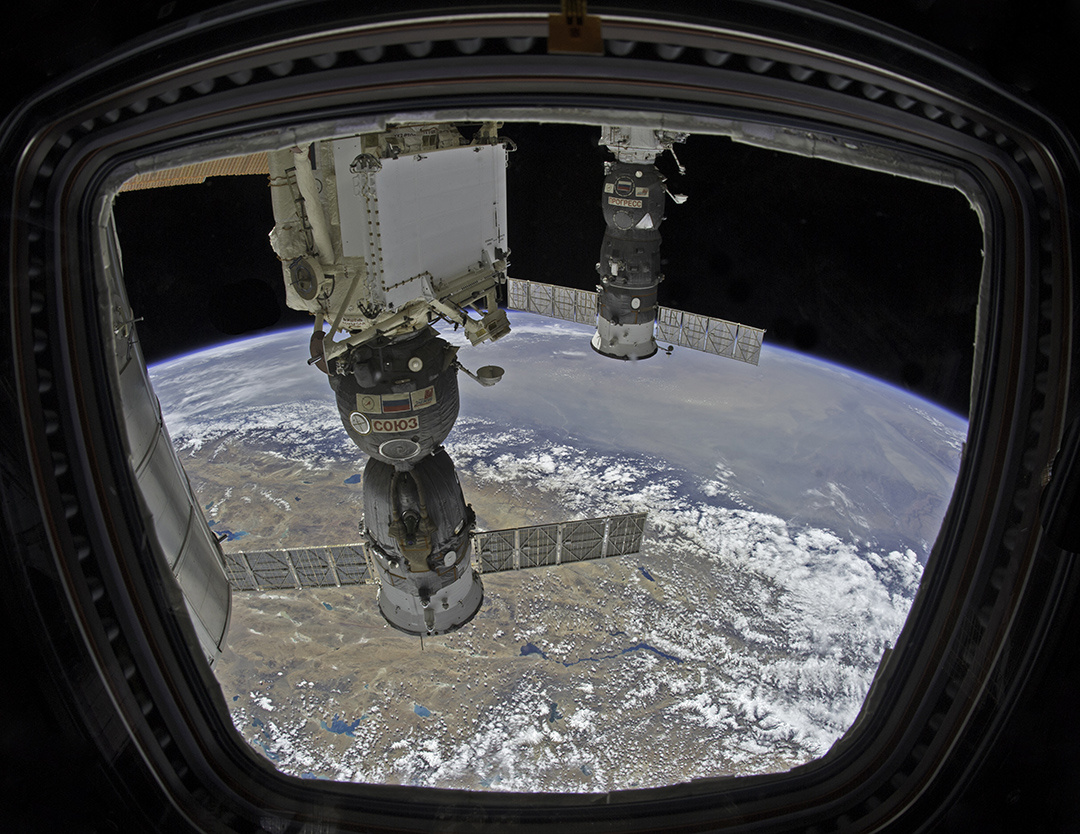 One window with three views; somewhere over China looking past the Himalayans into India